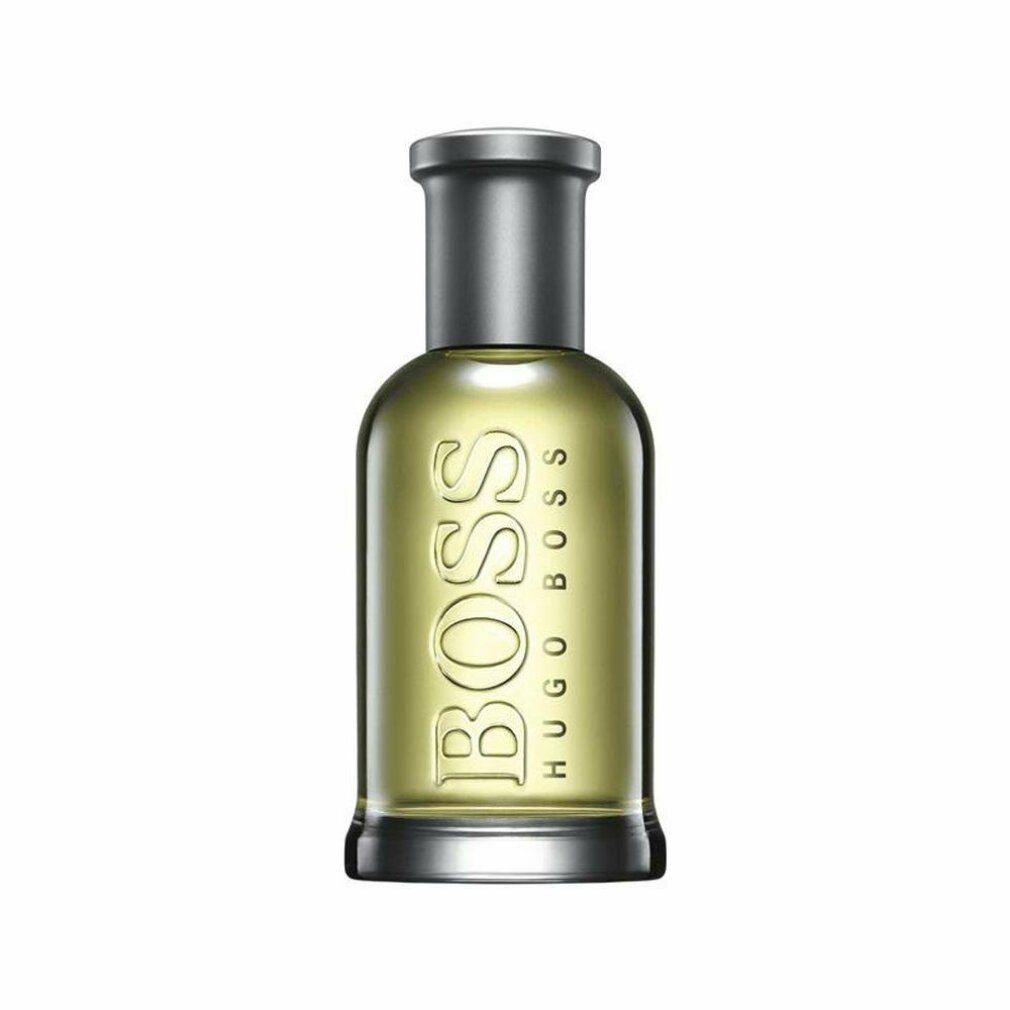 Flacon Boss Bottled Eau de Toilette. Flacon en verre avec bouchon argenté. Logo et nom du produit visibles.