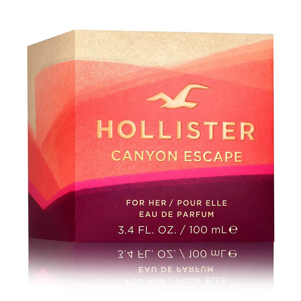 Verpakking Hollister Canyon Escape Eau de Parfum Spray. Verloop van rood en beige. Logo en productnaam in goud.