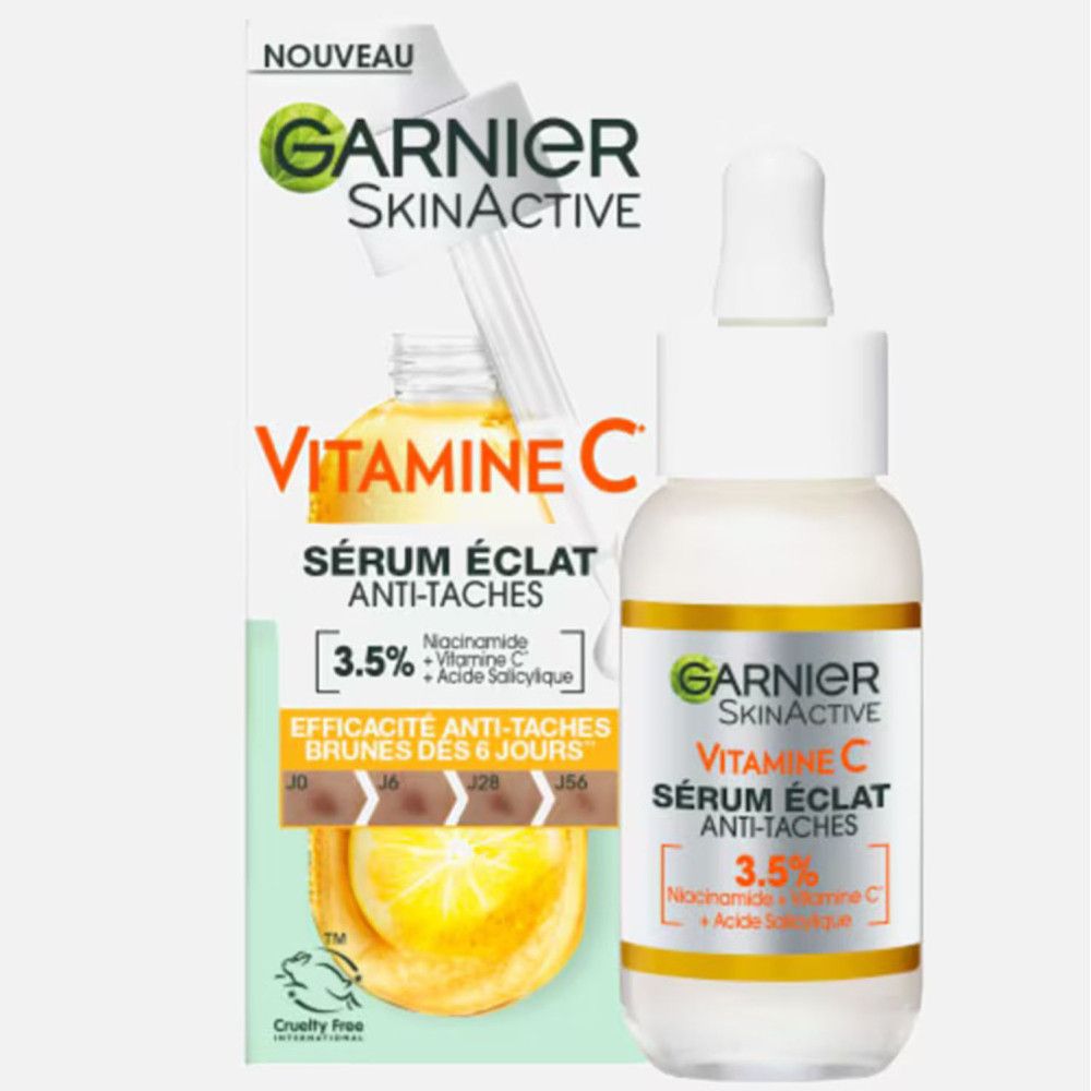 Emballage du produit et flacon de sérum avec pipette. Inscription: Garnier SkinActive Vitamin C Sérum Éclat Anti-Taches. Contient 3,5% Niacinamide, Vitamine C et Acide Salicylique.