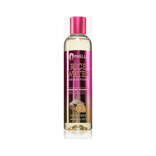 Shampoo fles met roze dop en etiket. Op het etiket staat "Mielle Rice Water Collection".