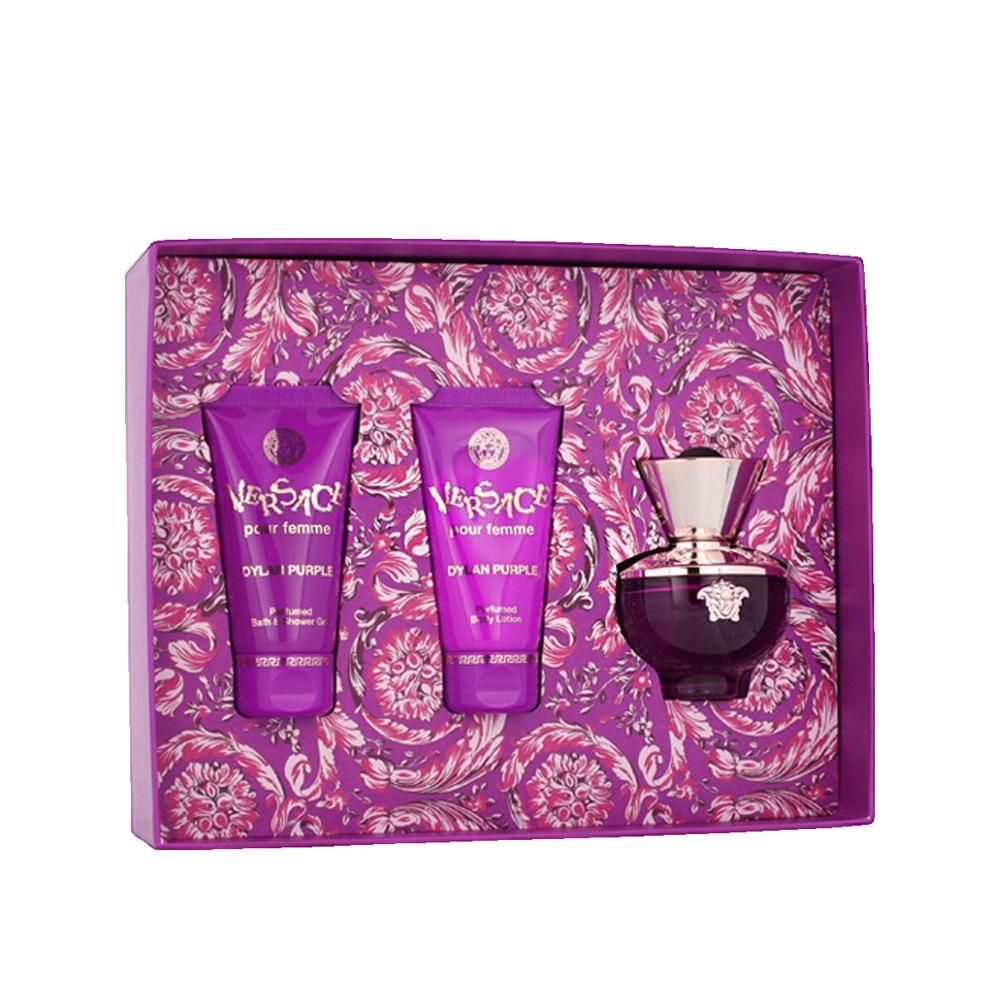 Coffret cadeau avec deux tubes et un flacon. Emballage violet à motifs floraux. Flacon avec bouchon doré.