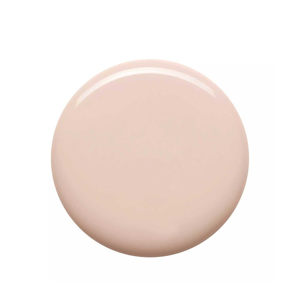 Tache circulaire de vernis à ongles beige clair. Surface brillante.