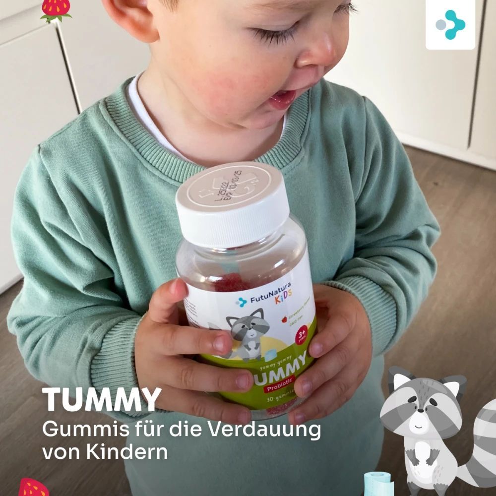 FutuNatura Tummy Kindergummies. Enfant tenant un flacon de bonbons. Texte : Gommes pour la digestion des enfants.