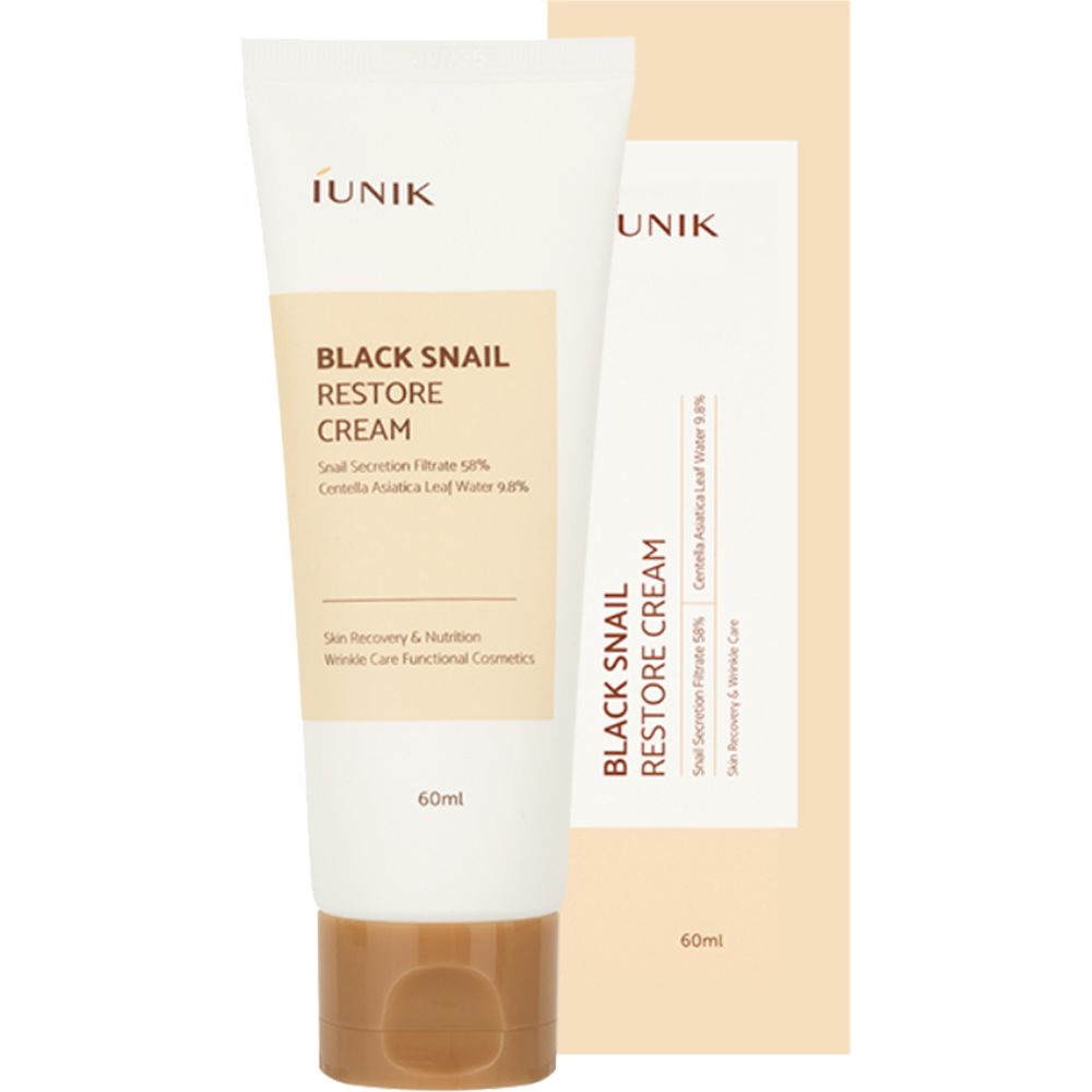 Tube de crème et emballage avec informations produit. Inscription: Black Snail Restore Cream, sécrétion d'escargot, Centella Asiatica. Bouchon marron.