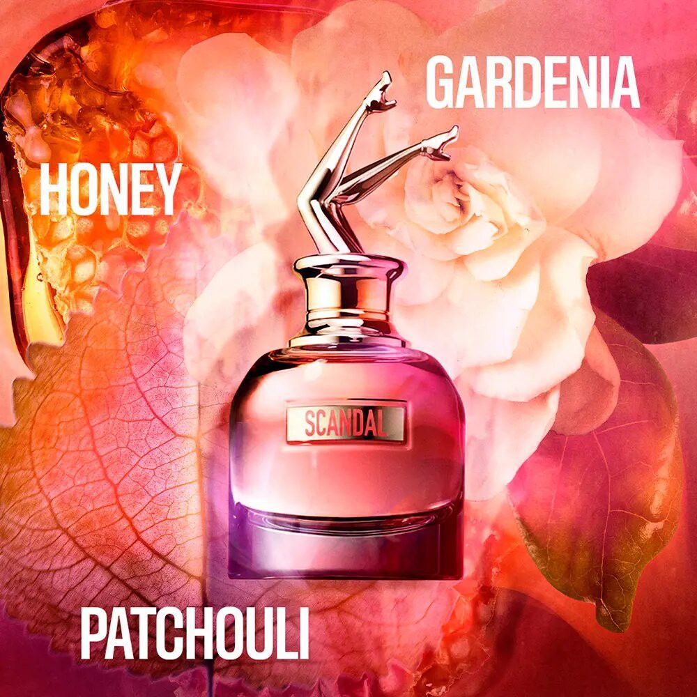 Roze fles met gouden benen-dop. Bloemen en ingrediëntnamen: Honing, Gardenia, Patchouli.