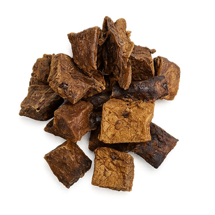 Hoop bruine, vierkante stukken. De stukken hebben een onregelmatige vorm en verschillende kleurschakeringen.