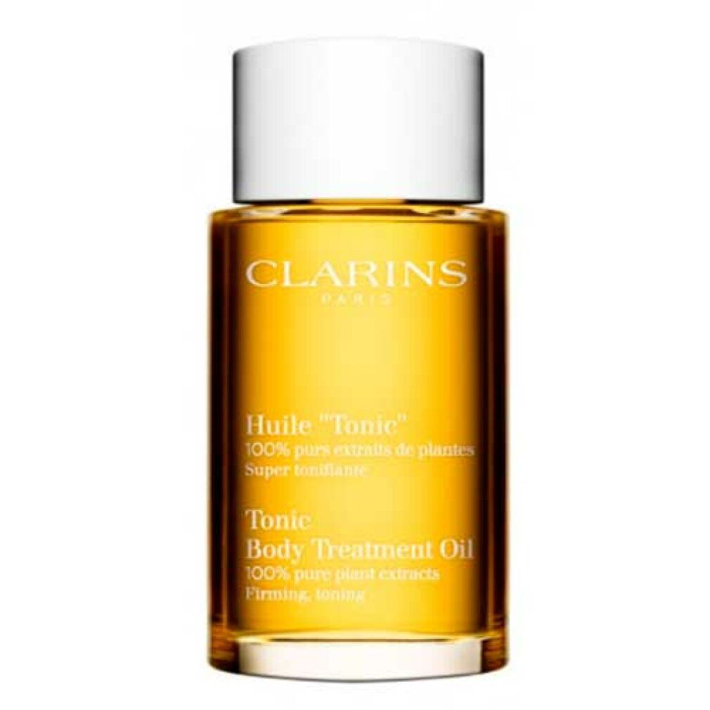 Clarins Huile Tonic Lichaamsolie in een glazen fles met witte dop.
