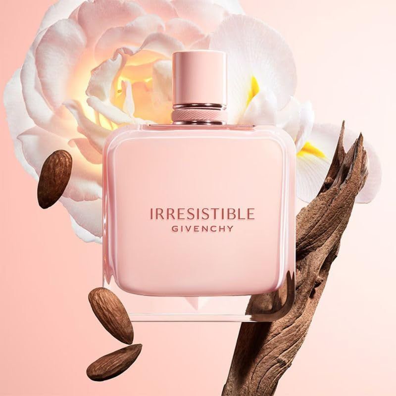 Givenchy Irresistible Nude Velvet Eau de Parfum. Flacon rose. Inscription 'Irresistible' et 'Givenchy'. Décoration avec fleurs et amandes.