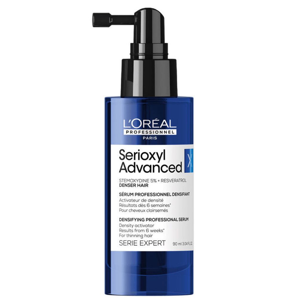 Flacon bleu avec applicateur noir. Inscription: Serioxyl Advanced, L'Oréal Professionnel, Serie Expert.