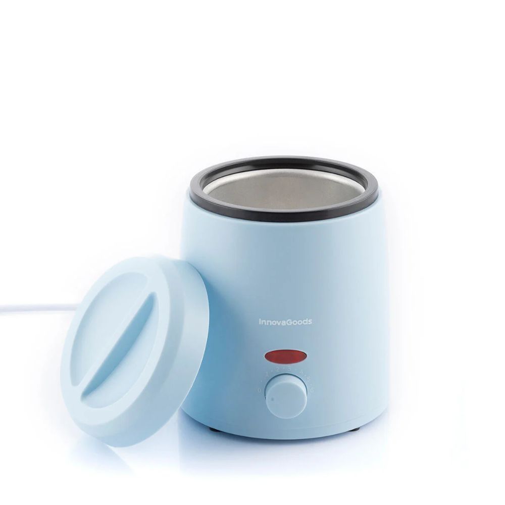 Chauffe-cire bleu avec couvercle. Bouton rouge et bouton rotatif. Couvercle à côté.