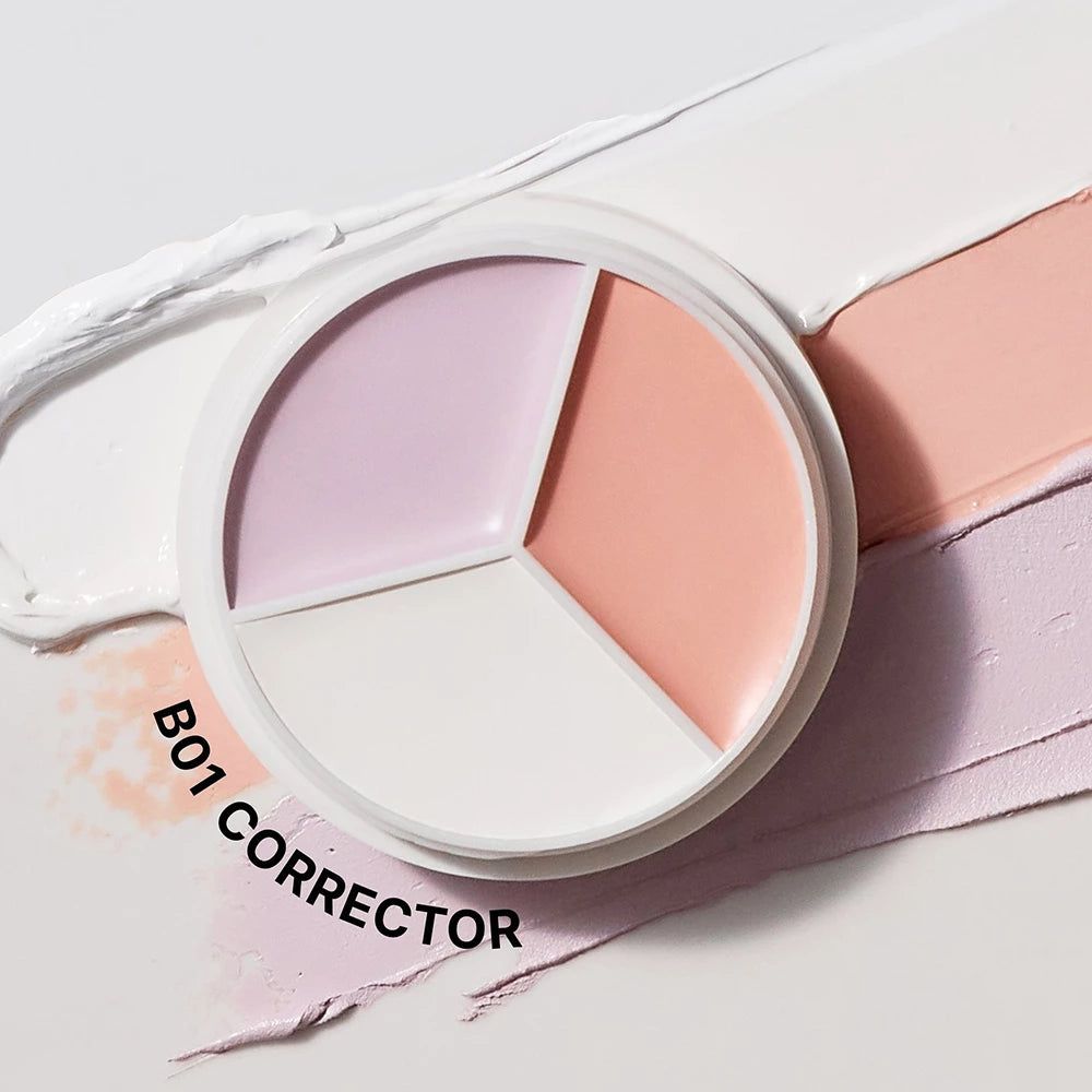 Contenant rond blanc avec trois zones colorées: blanc, rose et lilas. Texte: B01 CORRECTOR.