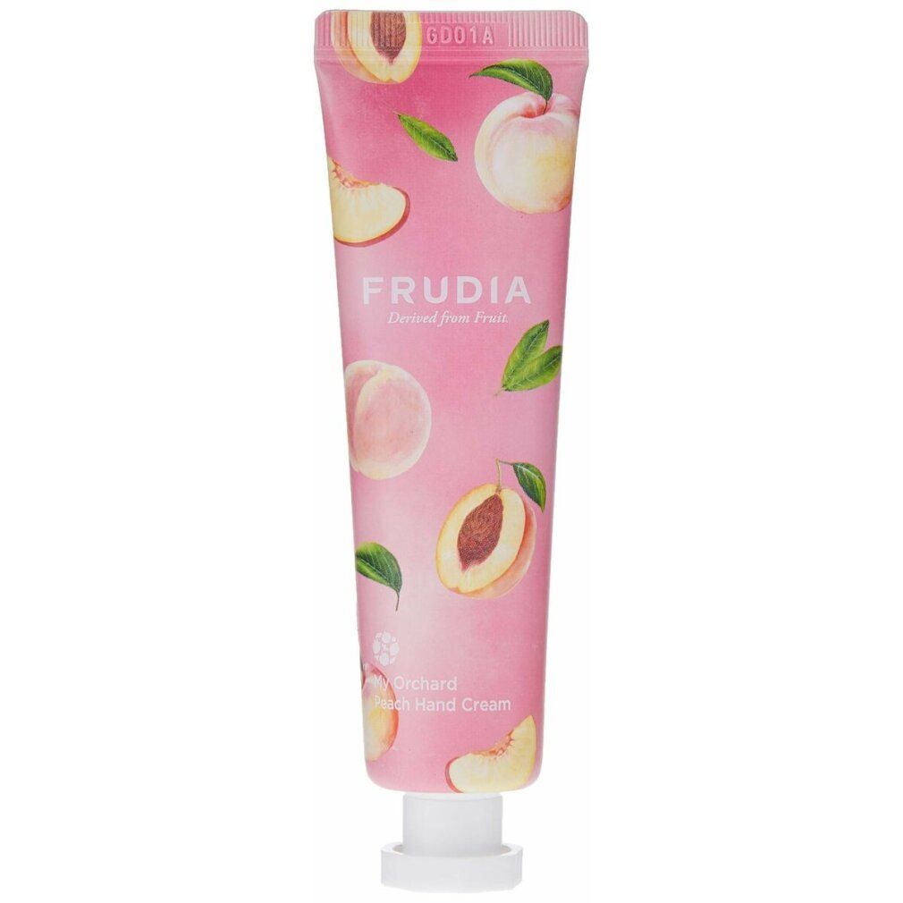 Roze tube met perzikmotief en opschrift FRUDIA. Productnaam: My Orchard Peach Hand Cream. Witte sluiting.