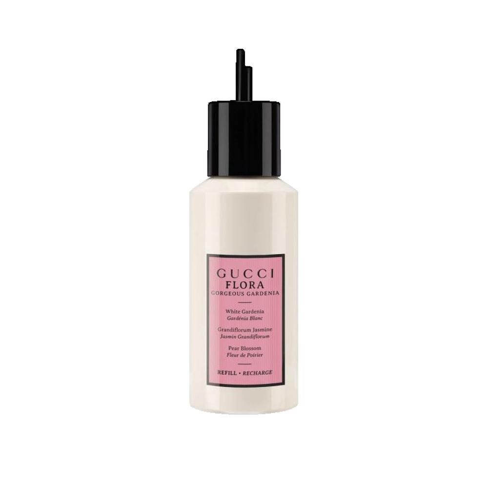 Flacon blanc avec bouchon noir. Étiquette rose avec nom du produit et ingrédients. "REFILL + RECHARGE".