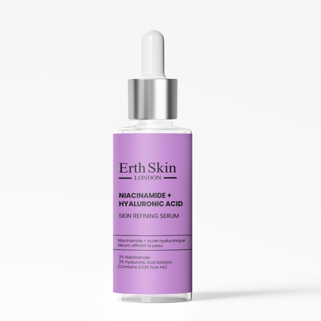 Serumfles met pipet. Opschrift: Niacinamide + Hyaluronzuur. Paars etiket. Bevat 3% Niacinamide.