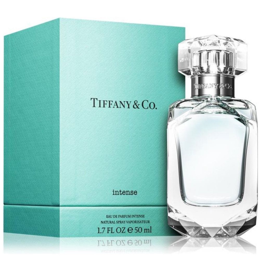 Turquoise doos en fles. Fles met zilveren sluiting en transparante dop. Opschrift: Tiffany & Co. Intense.