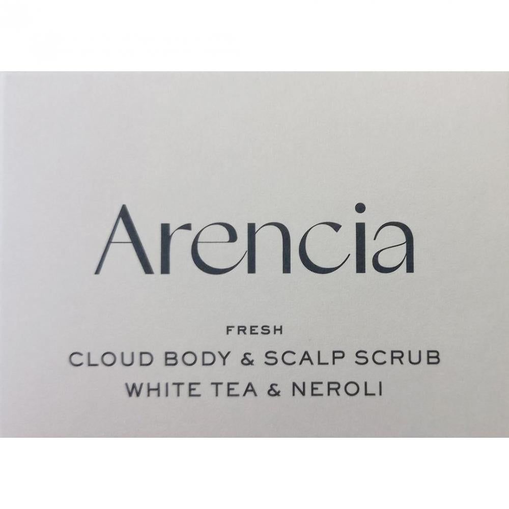 Witte verpakking met ARENCIA-opschrift, 'FRESH CLOUD BODY & SCALP SCRUB WHITE TEA & NEROLI'.