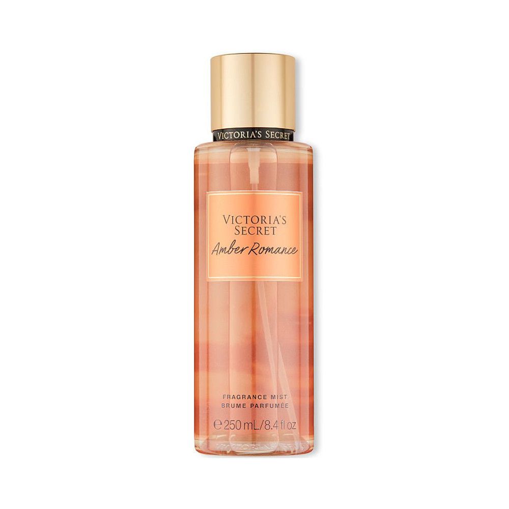 Flacon de brume parfumée Victoria's Secret Amber Romance. Bouchon doré, contenu orangé, étiquette.