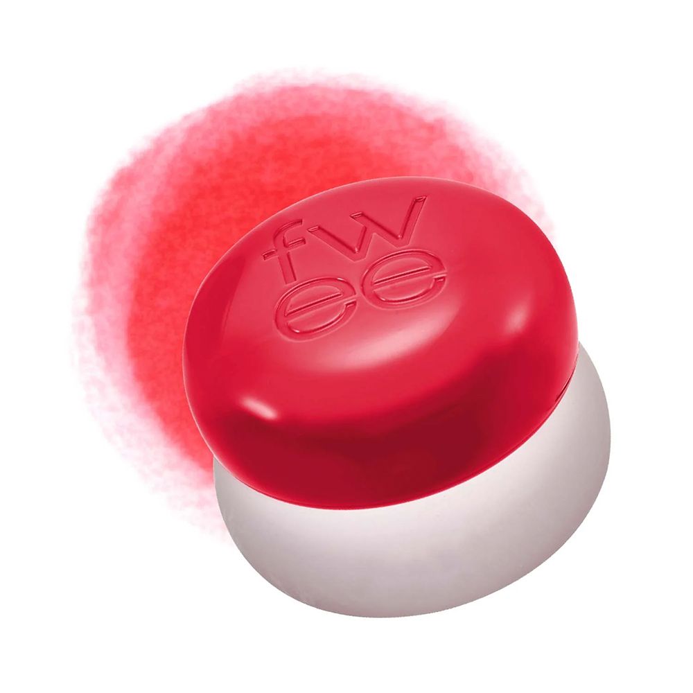 Récipient rond rouge avec le logo 'fwee' sur fond blanc et rouge.