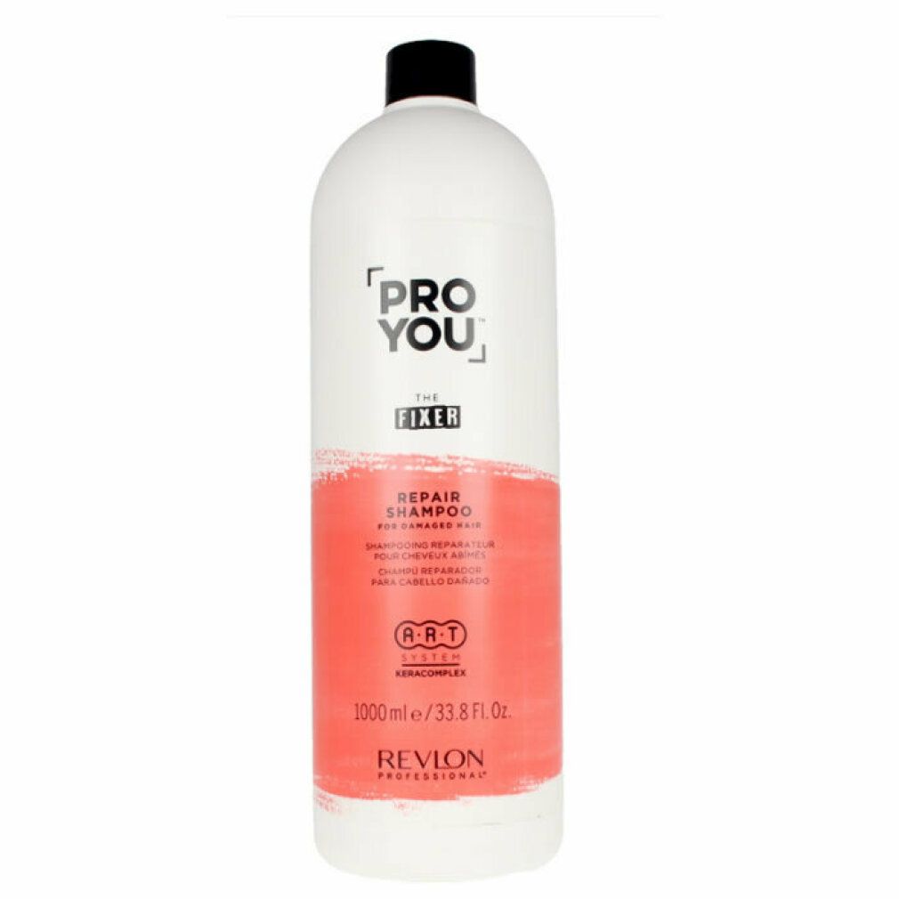 Witte fles met zwarte dop. Opschrift: Pro You The Fixer Repair Shampoo. Rode kleurvlak. Revlon Professional.
