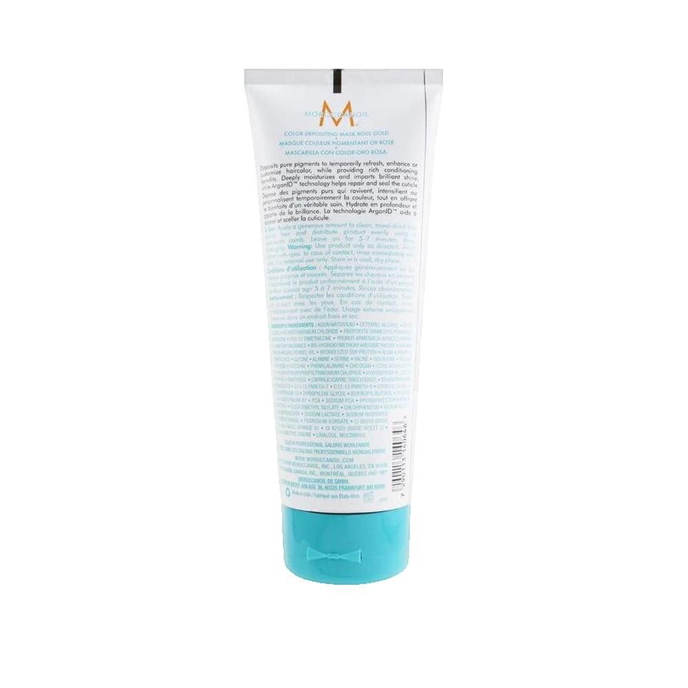 Dos d'un tube blanc avec bouchon turquoise. Texte en plusieurs langues. Nom du produit non visible.