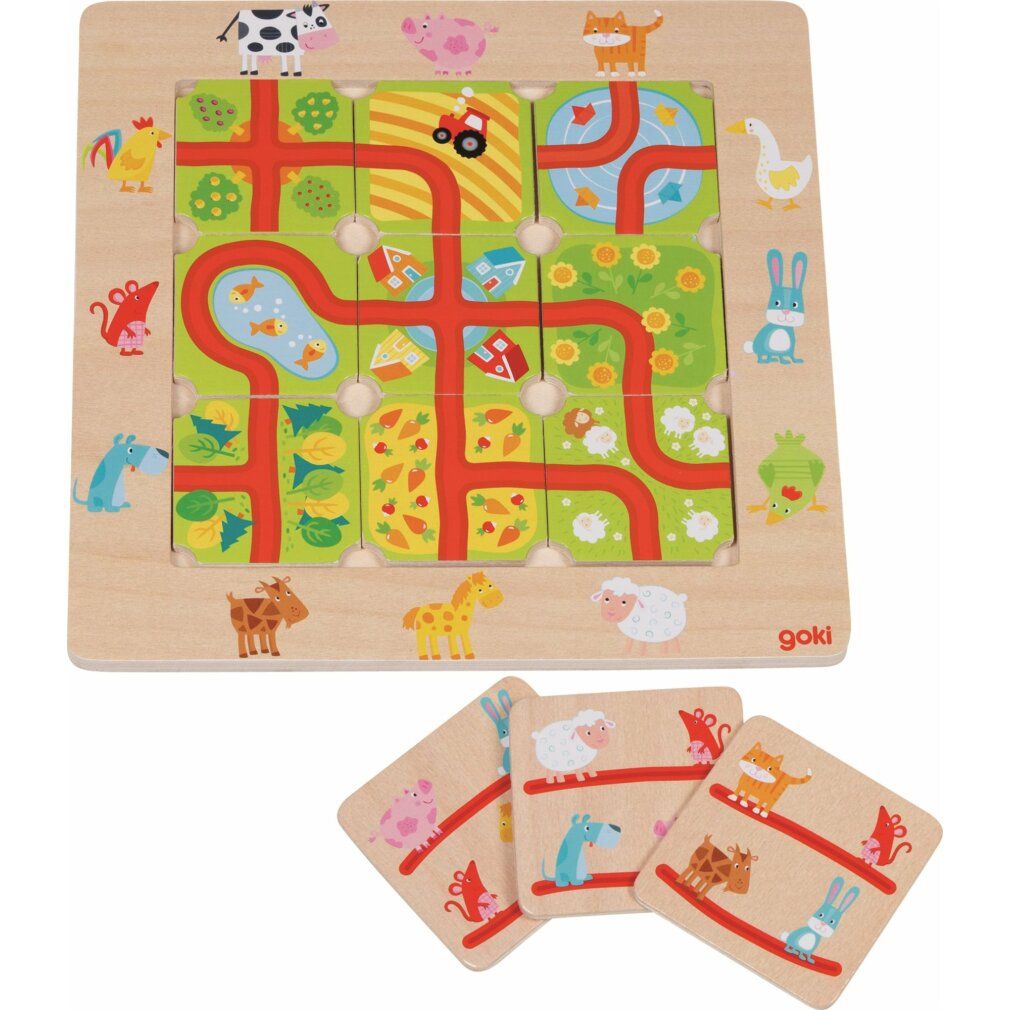 Houten puzzel met dieren en wegen. Het bord is vierkant met puzzelstukjes. Goki-logo rechtsonder.