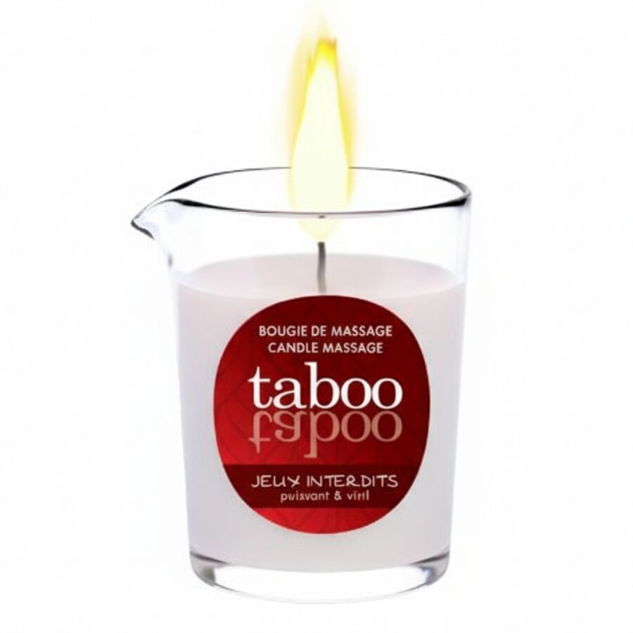 Bougie dans un verre avec étiquette rouge. Inscription: taboo, Jeux Interdits. Flamme allumée. Bougie de massage.