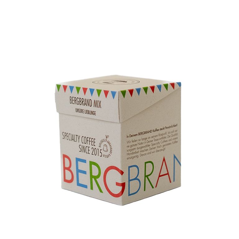 Capsule verpakking. Tekst: BERGBRAND MIX, Specialty Coffee, sinds 2015. Meerkleurig ontwerp.