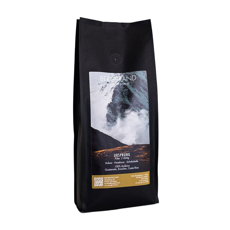 Paquet de café noir. Texte : BERGBRAND, Ursprung, Filter, 250g. Ingrédients : cacao, noisette, chocolat, 100% Arabica.