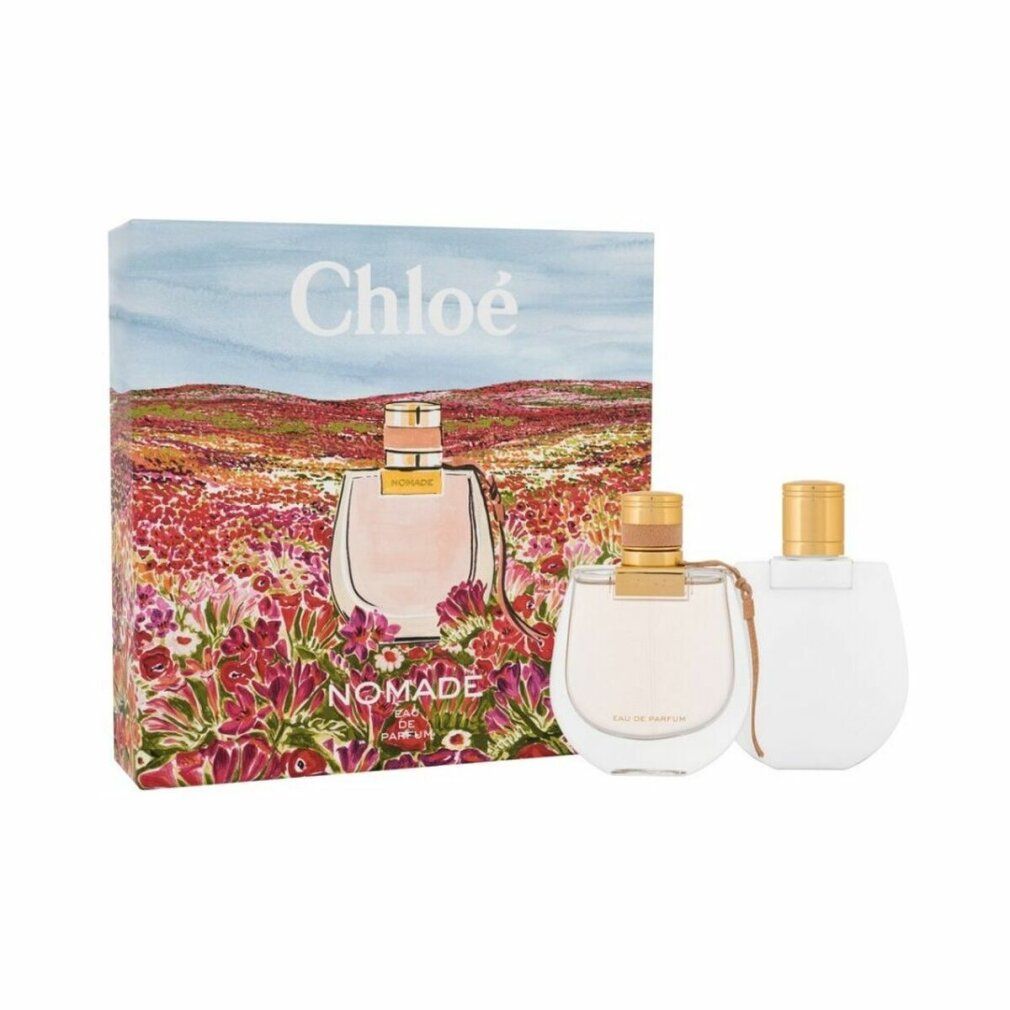 Cadeauset met twee parfumflesjes en een doos. De doos toont een bloemenveld en de tekst Chloé Nomade.