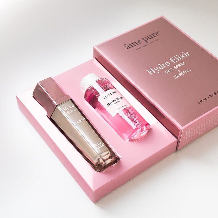 Coffret âme pure Hydro Elixir avec spray et recharge dans une boîte rose.