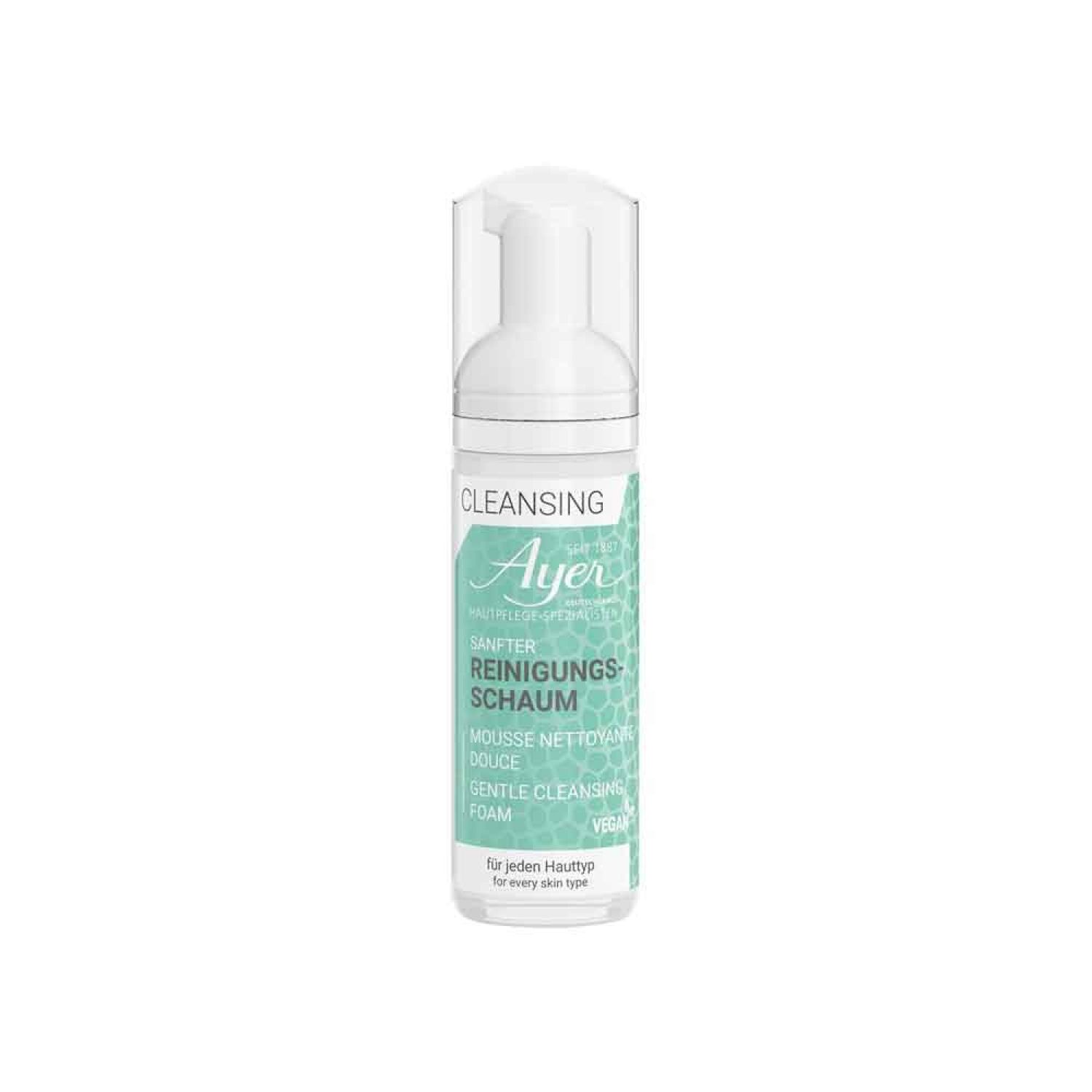 Flacon de mousse nettoyante. Récipient blanc avec pompe et bouchon transparent. Étiquette turquoise avec nom du produit et logo.