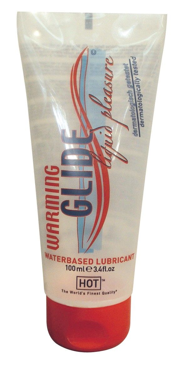 Tube transparent avec bouchon rouge. Étiquette : WARMING GLIDE, waterbased lubricant, 100ml. Avec sceaux.