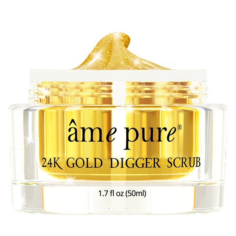 Un pot de gommage 24K Gold Digger scintillant, contenu doré.