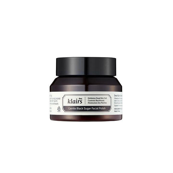 Bruine crème in een zwart potje met deksel. Opschrift: Klairs Gentle Black Sugar Facial Polish.