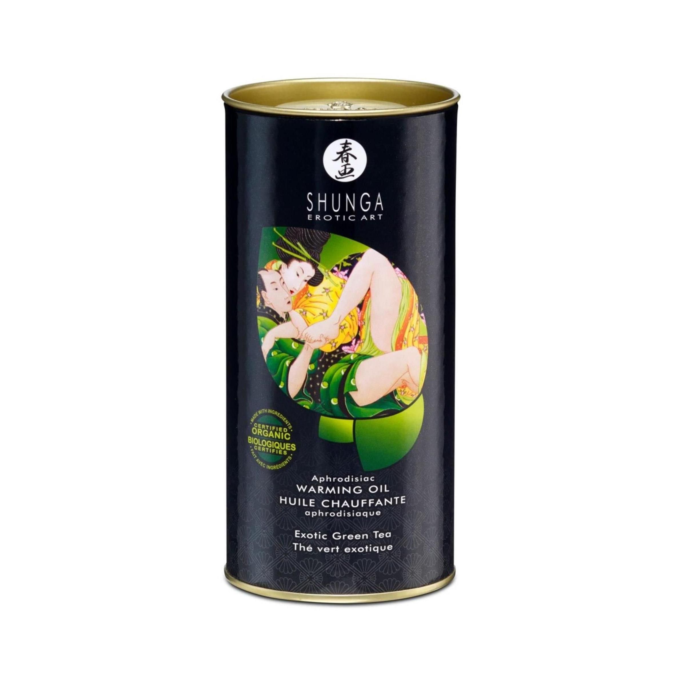 Boîte cylindrique avec illustration. Inscription: SHUNGA, Exotic Art. Texte: Warming Oil, Aphrodisiaque, Thé vert exotique.