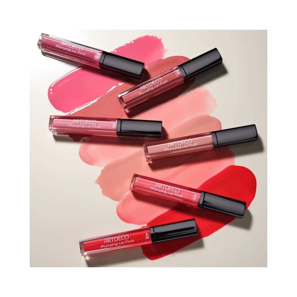 Plusieurs gloss Artdeco Plumping Lip Fluid. Couleurs variées, bouchons noirs, étuis transparents.