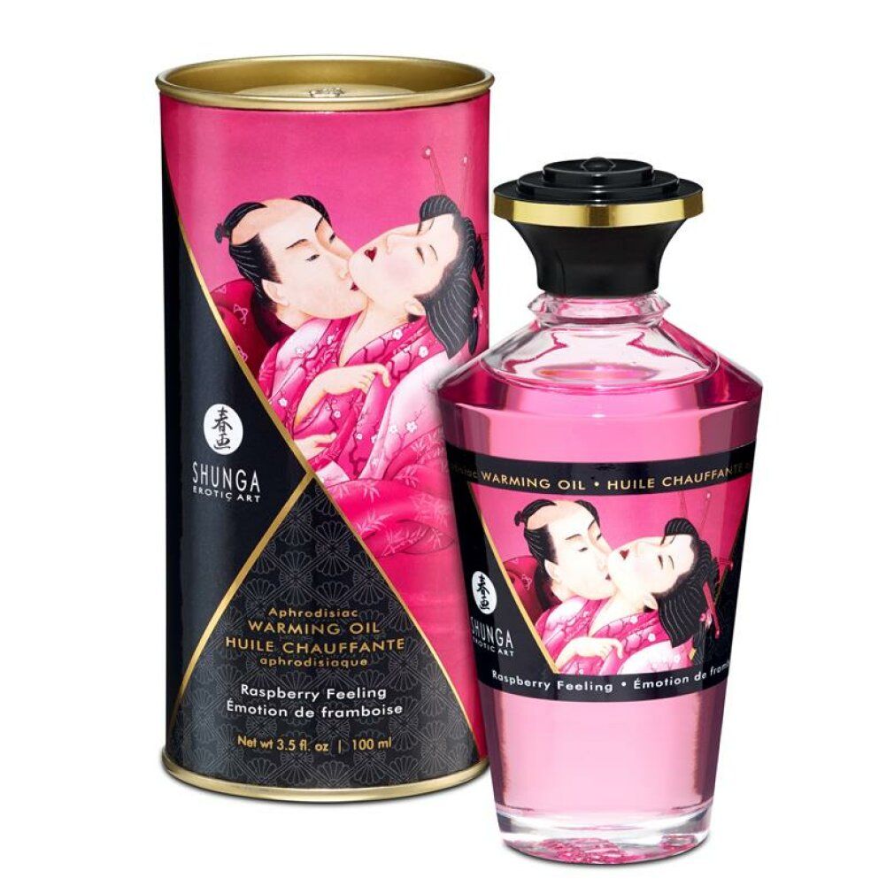 Huile de massage à la framboise et emballage. Bouteille et boîte avec illustrations. Inscription : Shunga, Warming Oil.