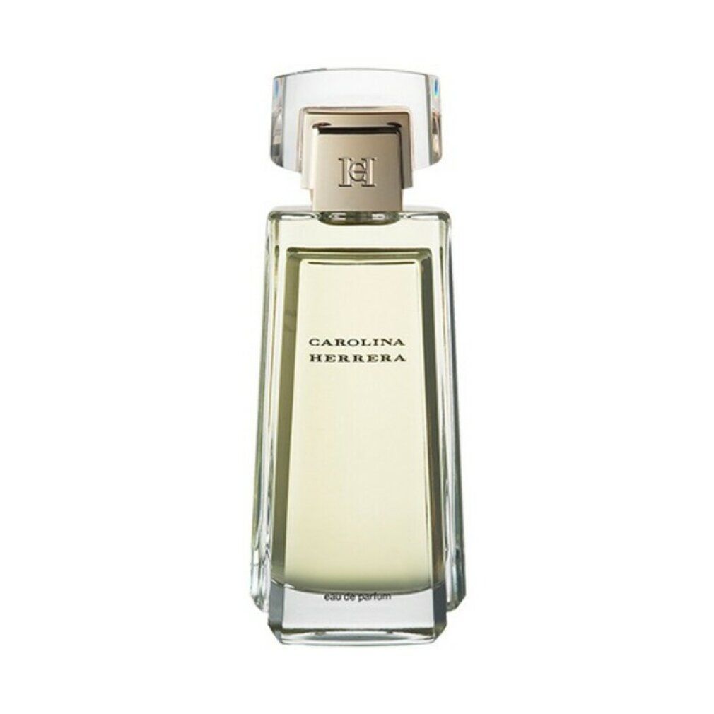 Rechthoekige parfumfles van transparant glas, gouden dop. Opschrift: CAROLINA HERRERA. Eau de parfum.