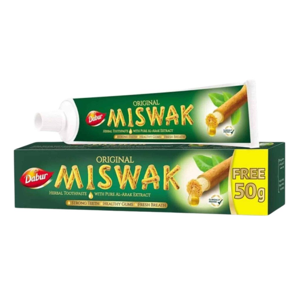 Tube et boîte de dentifrice. Inscription : Original Miswak. Emballage vert et doré. Contient de l'extrait d'al-arak. Gratuit 50g.