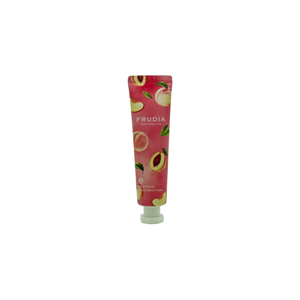 Handcrèmetube met perzikmotief. Opschrift: FRUDIA. Productnaam: My Orchard Peach Hand Cream. Roze tube met witte dop.