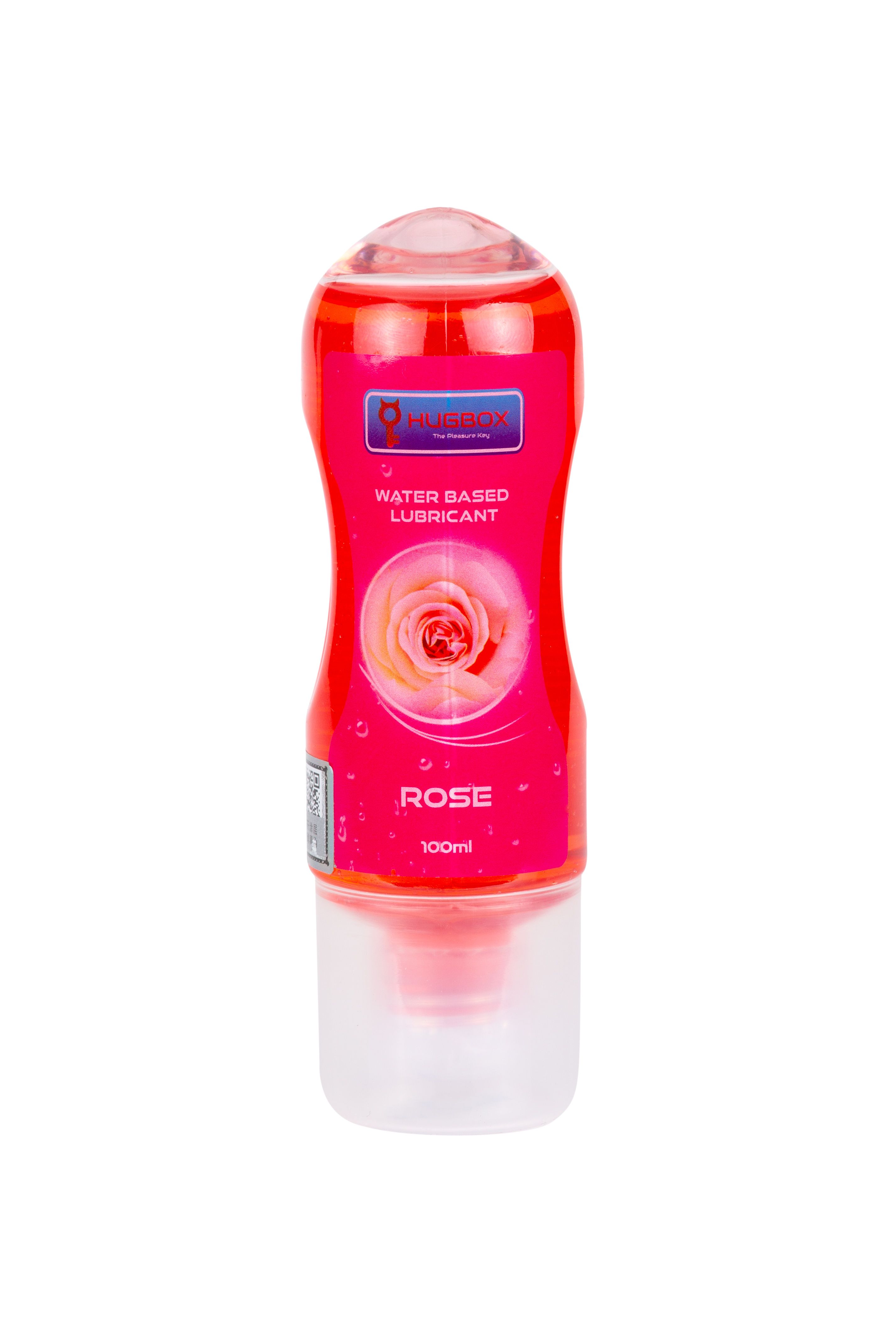 Flacon rouge, liquide rose. Étiquette avec rose et texte. Tête de dosage transparente. Nom du produit non visible. 100ml.