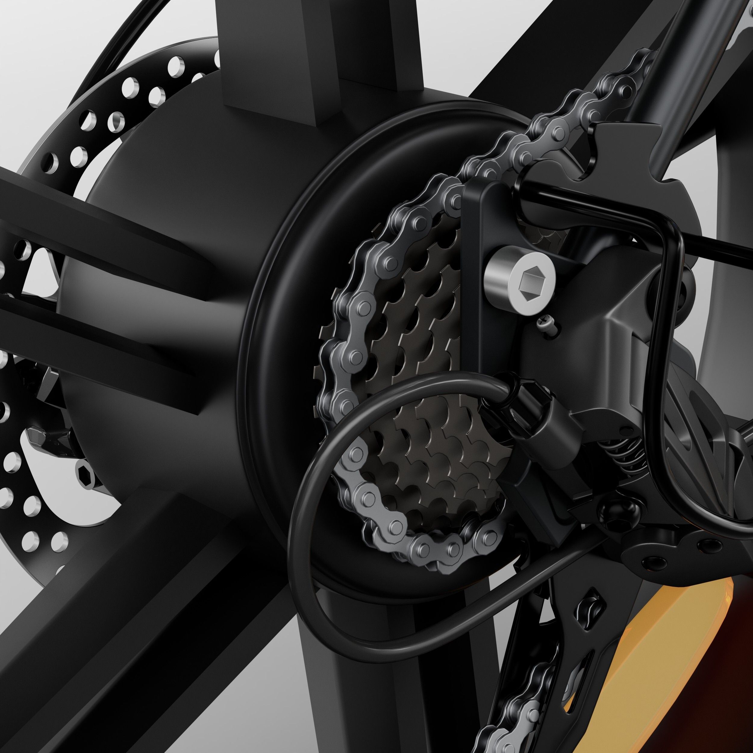 Gros plan sur la roue arrière d'un vélo pliant noir. Chaîne, pignons et disque de frein visibles.