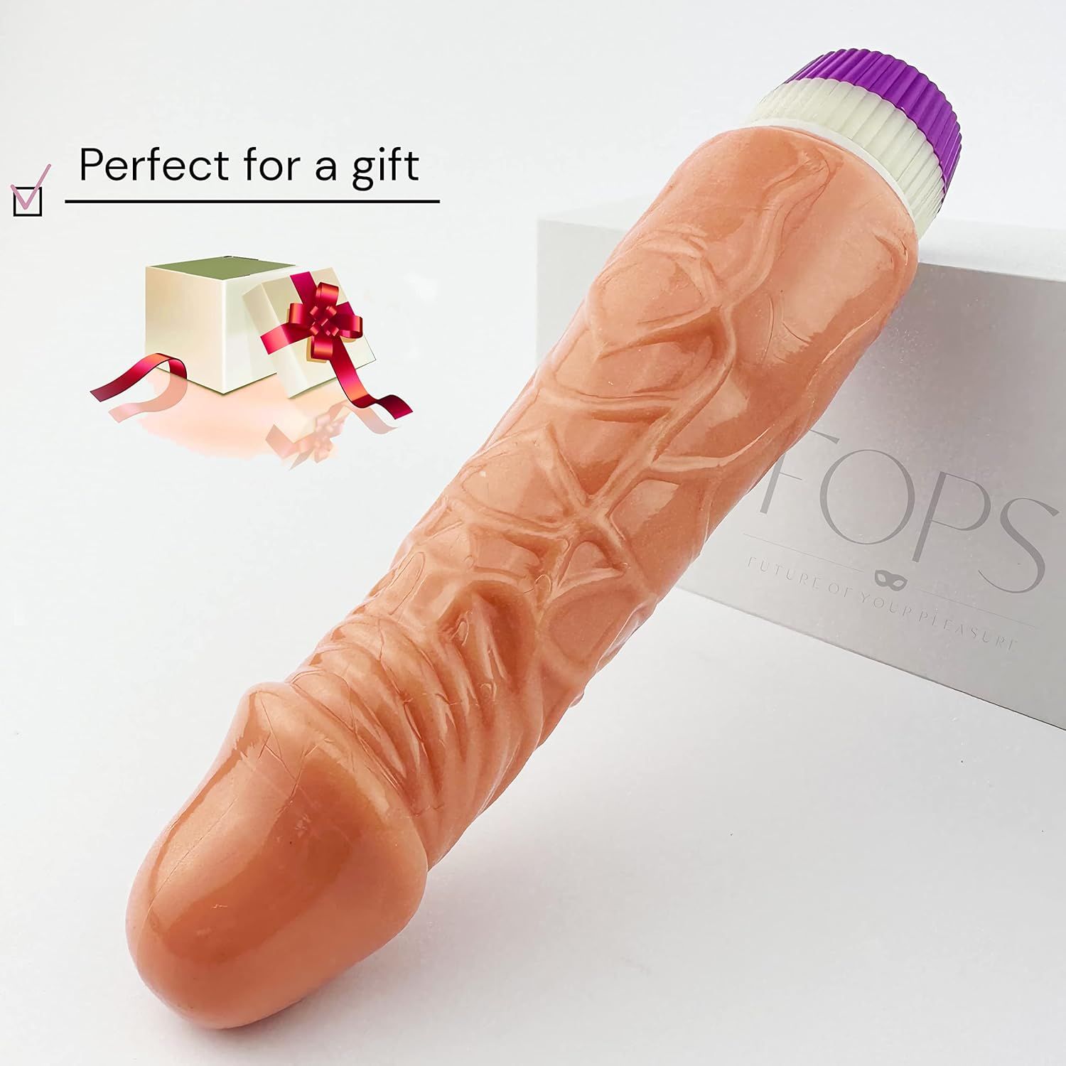 Beige dildo met realistische textuur. Paars-wit uiteinde. Tekst: Perfect for a gift. Verpakking.