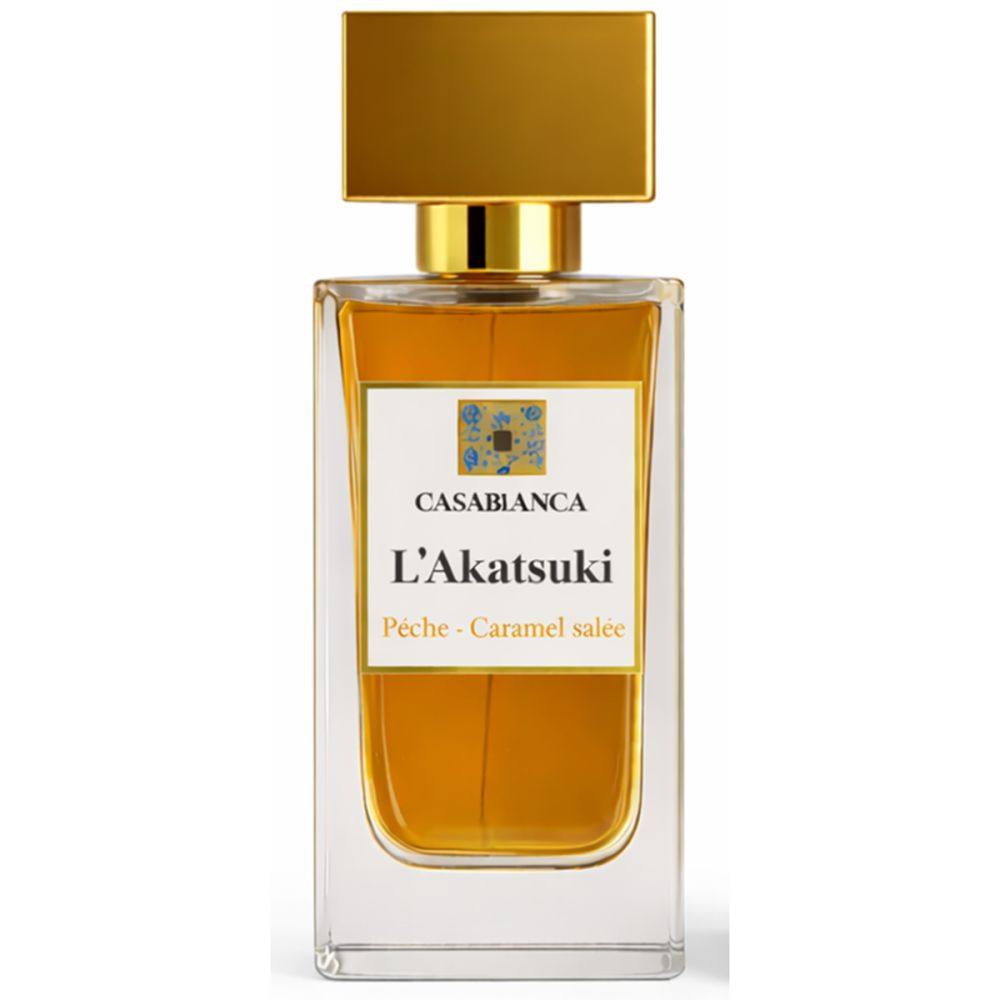 Flacon de parfum avec bouchon doré. Étiquette avec nom du produit et ingrédients. Liquide ambré.
