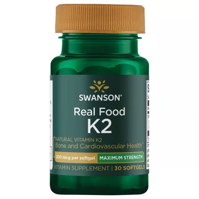 Flacon vert avec bouchon marron. Inscription: SWANSON Real Food K2. Contient 30 gélules. Complément alimentaire à la vitamine K2.
