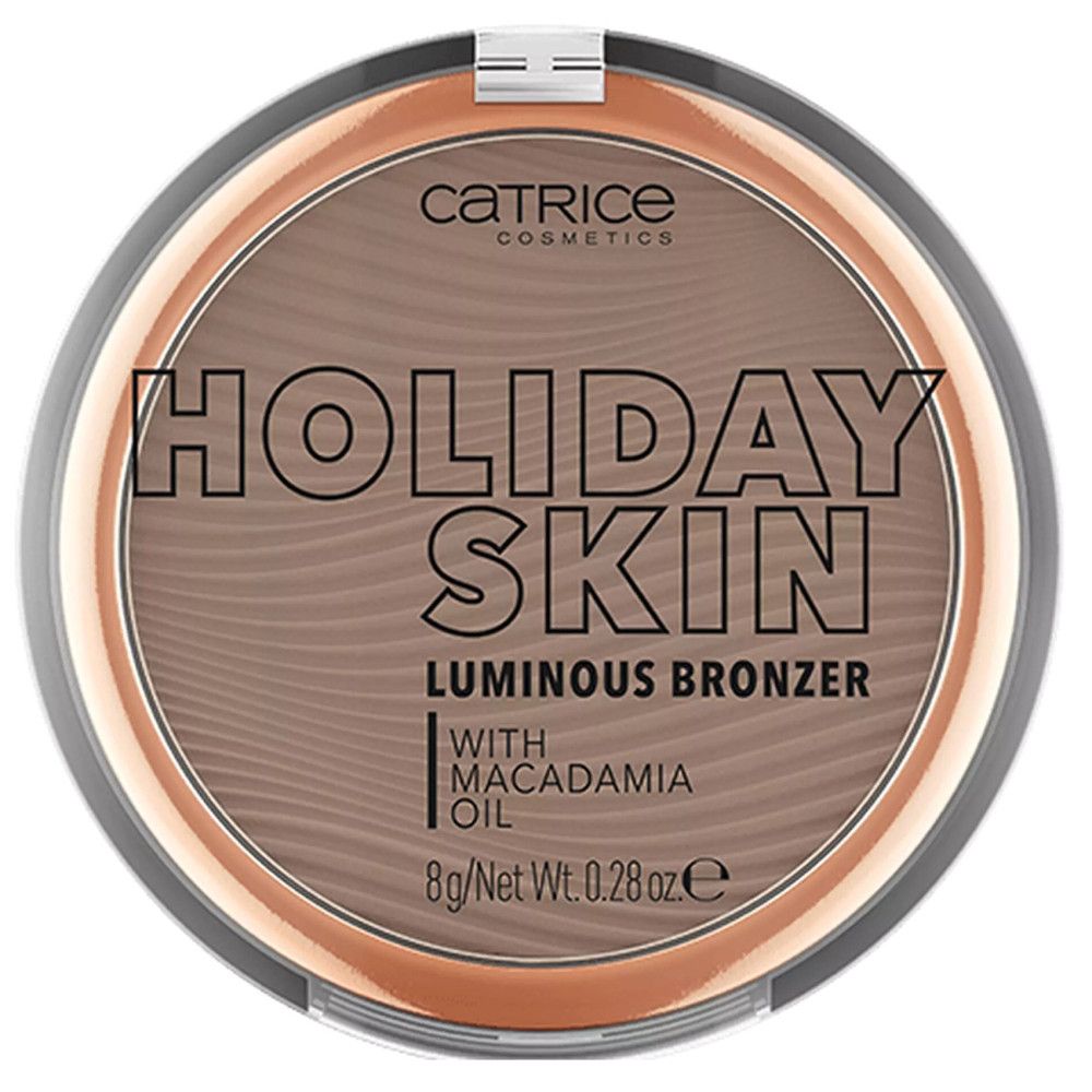 Ronde compacte bronzer met deksel. Opschrift: Catrice, Holiday Skin Luminous Bronzer. Met Macadamia Oil. Inhoud: 8g/Net Wt. 0.28 oz e.