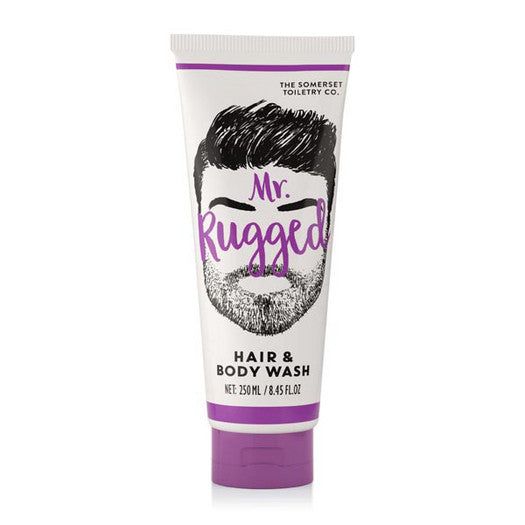 Tube blanche et violette avec illustration de barbe. Texte: Mr. Rugged, Hair & Body Wash. Marque: The Somerset Toiletry Co.