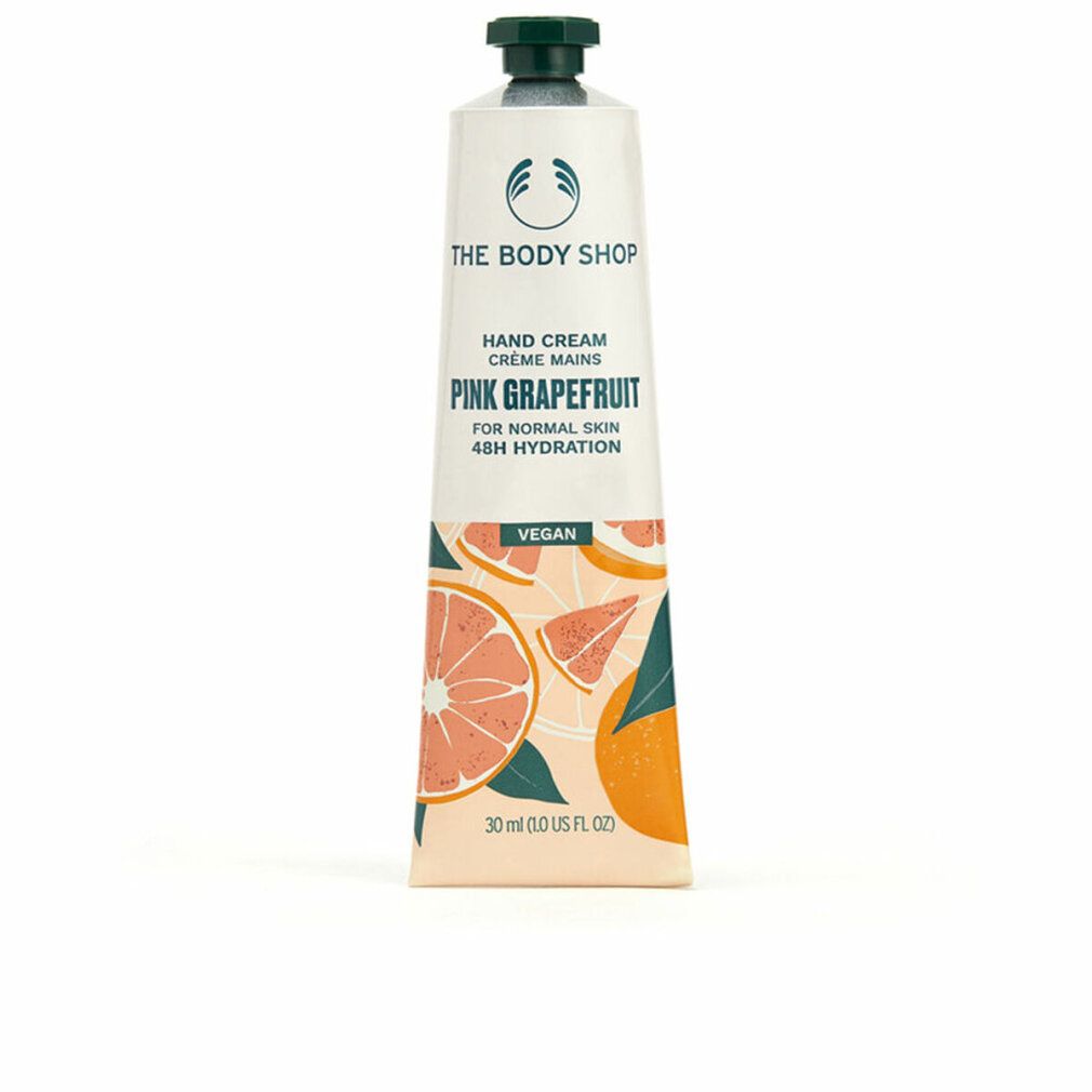 Handcrèmetube. Wit, met groene dop. Opschrift: Pink Grapefruit, Vegan. Illustraties van grapefruit. Merk: The Body Shop.