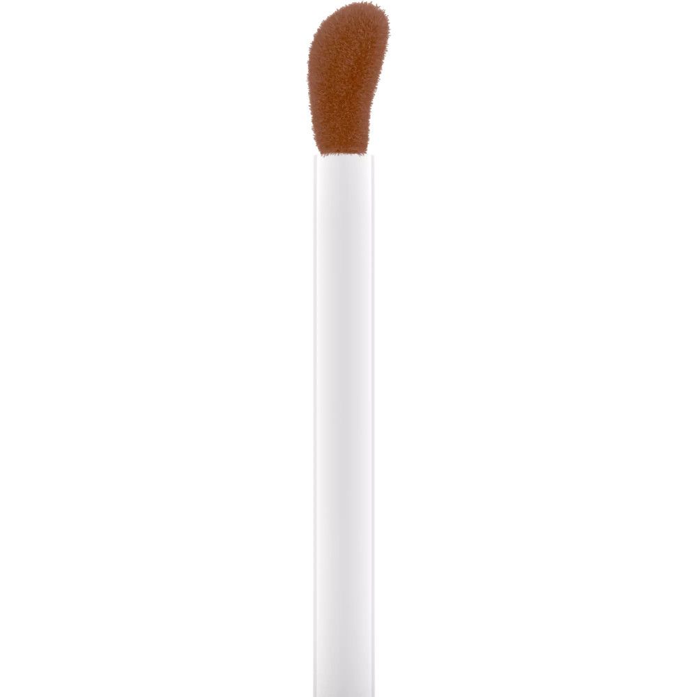 Applicateur blanc avec extrémité éponge marron. L'applicateur est destiné au bronzer liquide.