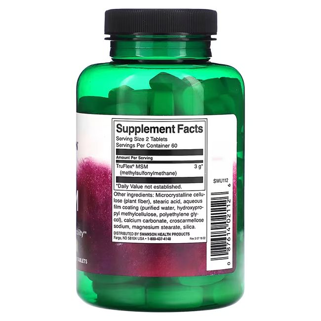 Achteraanzicht van een groene fles met zwarte dop. Etiket met voedingsinformatie en ingrediënten. Tabletten zichtbaar.
